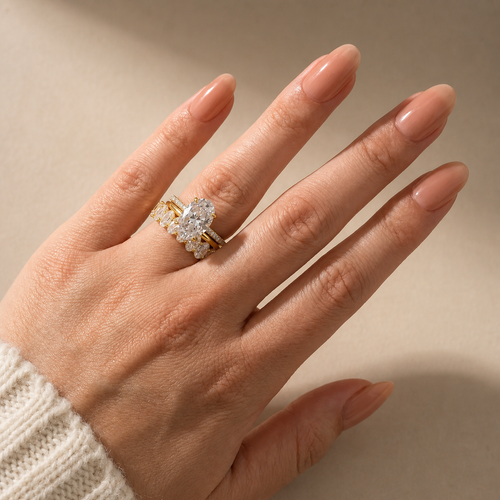 Elara three-piece oval wedding ring set in yellow gold – worn view