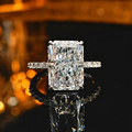 LAVEELLE Aurora radiant-cut pavé ring on a warm amber background
